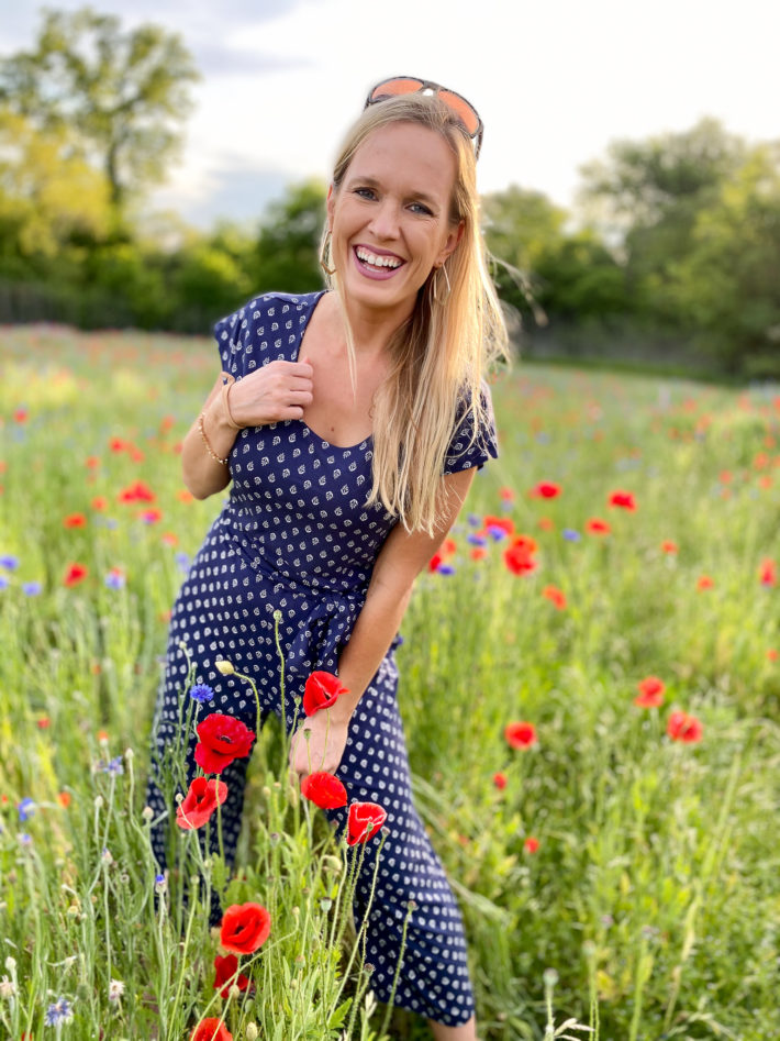 Surrounded by Texas wildflowers doing an Old Navy spring haul featuring affordable fashion. 